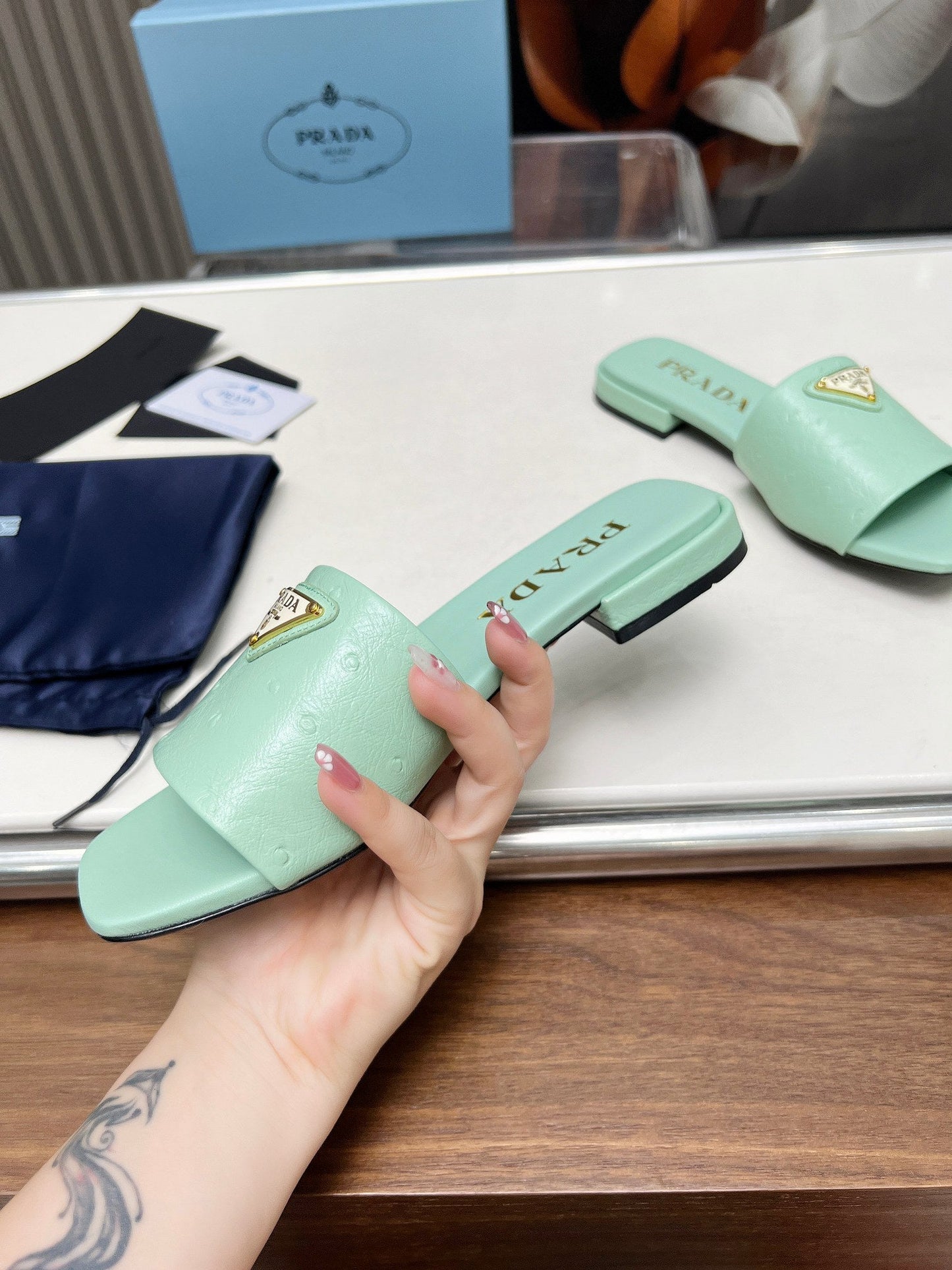 PRA SAFFIANO PATENT SLIDES OSTRICH MOTIF SEAFOAM CALFSKIN