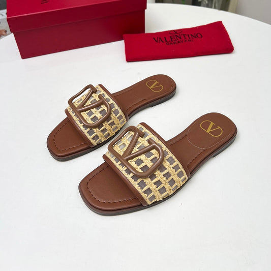 Vlogo embellished leather-trimmed raffia slides tan