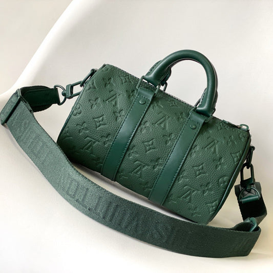 KEEPALL BANDOULIÈRE 25 IN FOREST GREEN MONOGRAM EMBOSSED CALFSKIN