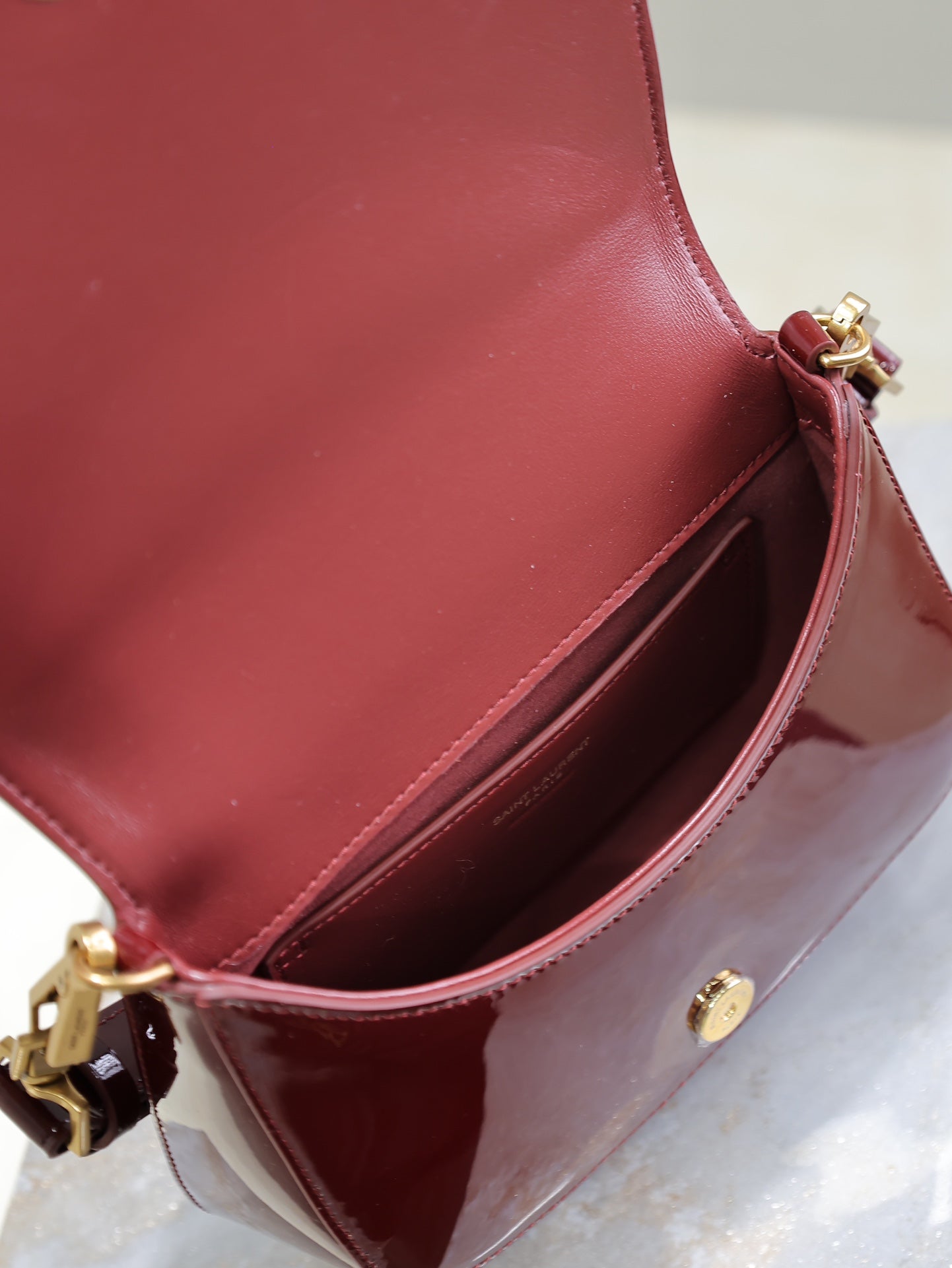 VOLTAIRE SADDLE BAG 21 IN BORDEAUX RED PATENT CALFSKIN