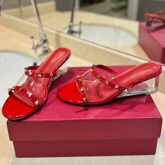 ROCKSTUD MULE SANDALS IN CHERRY RED CALFSKIN AND TRANSPARENT PVC FILM