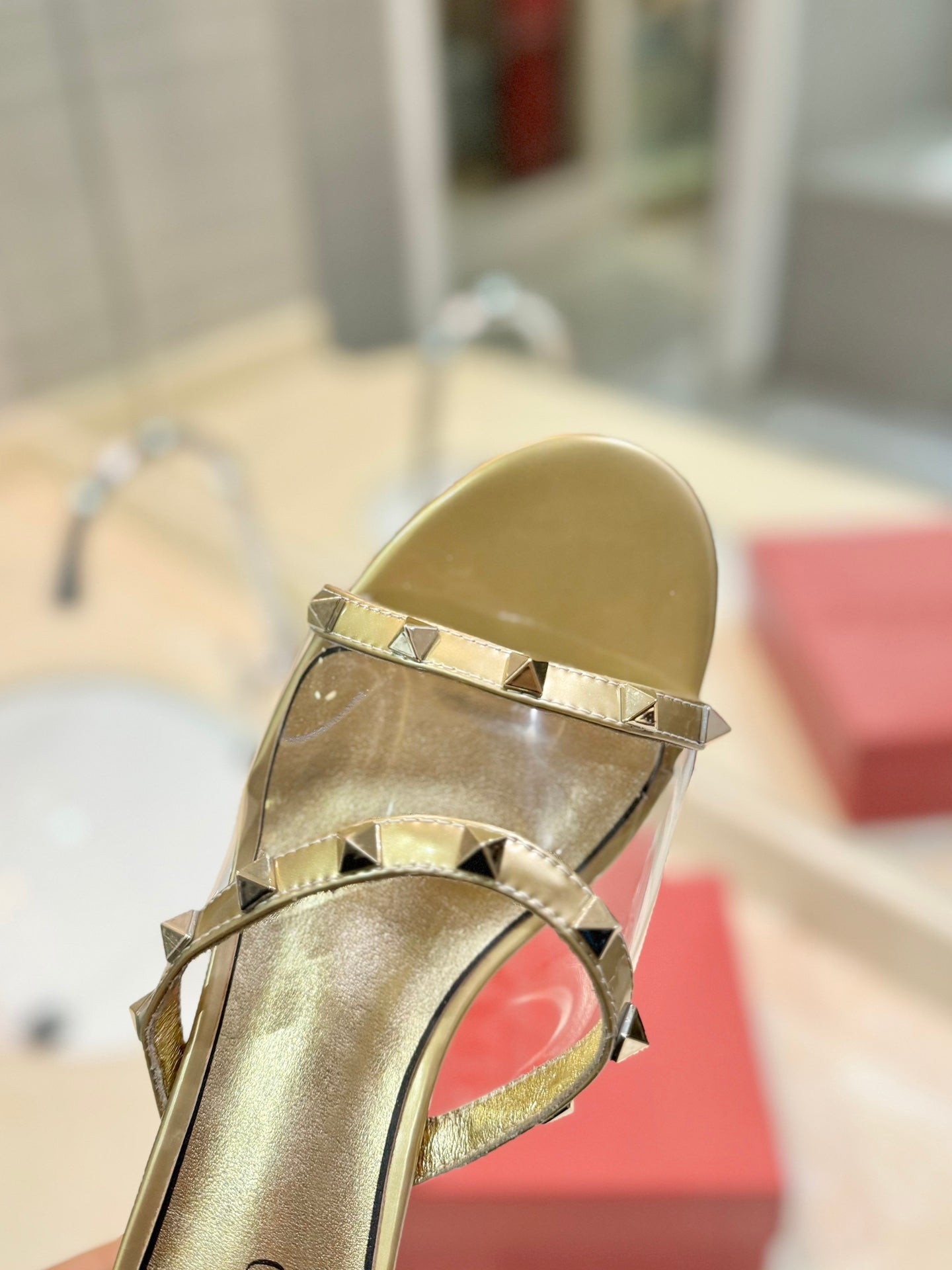 ROCKSTUD MULE SANDALS IN GOLD CALFSKIN AND TRANSPARENT PVC FILM