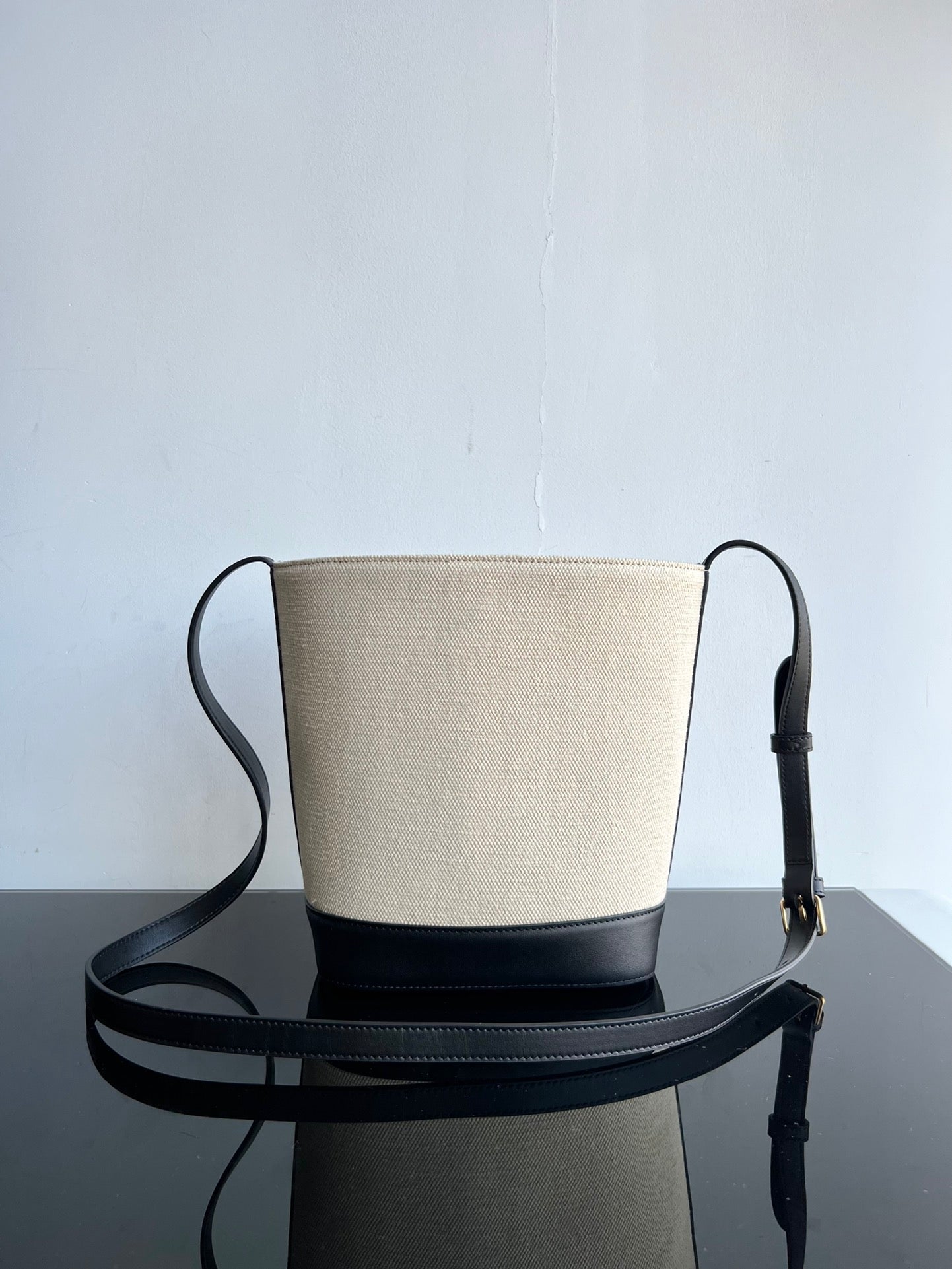 SMALL BUCKET CUIR TRIOMPHE 24CM IN STRIPED TEXTILE AND BLACK CALFSKIN