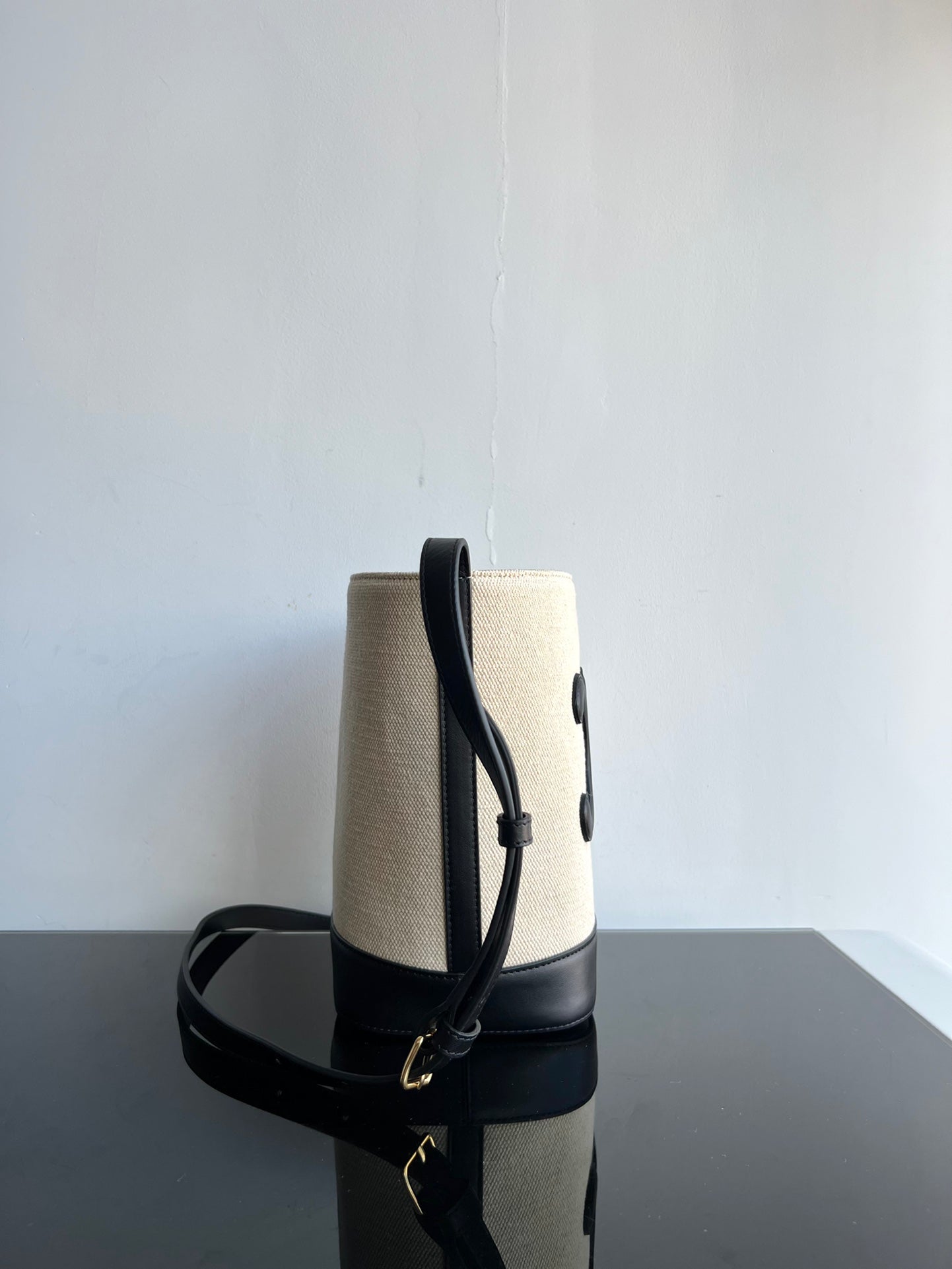 SMALL BUCKET CUIR TRIOMPHE 24CM IN STRIPED TEXTILE AND BLACK CALFSKIN